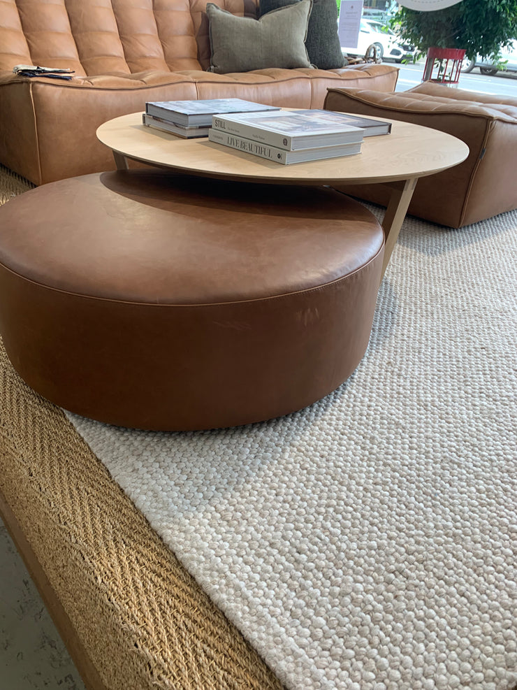 CIRCLE LOW LINE OTTOMAN- SETTLER TAPA TAN LEATHER